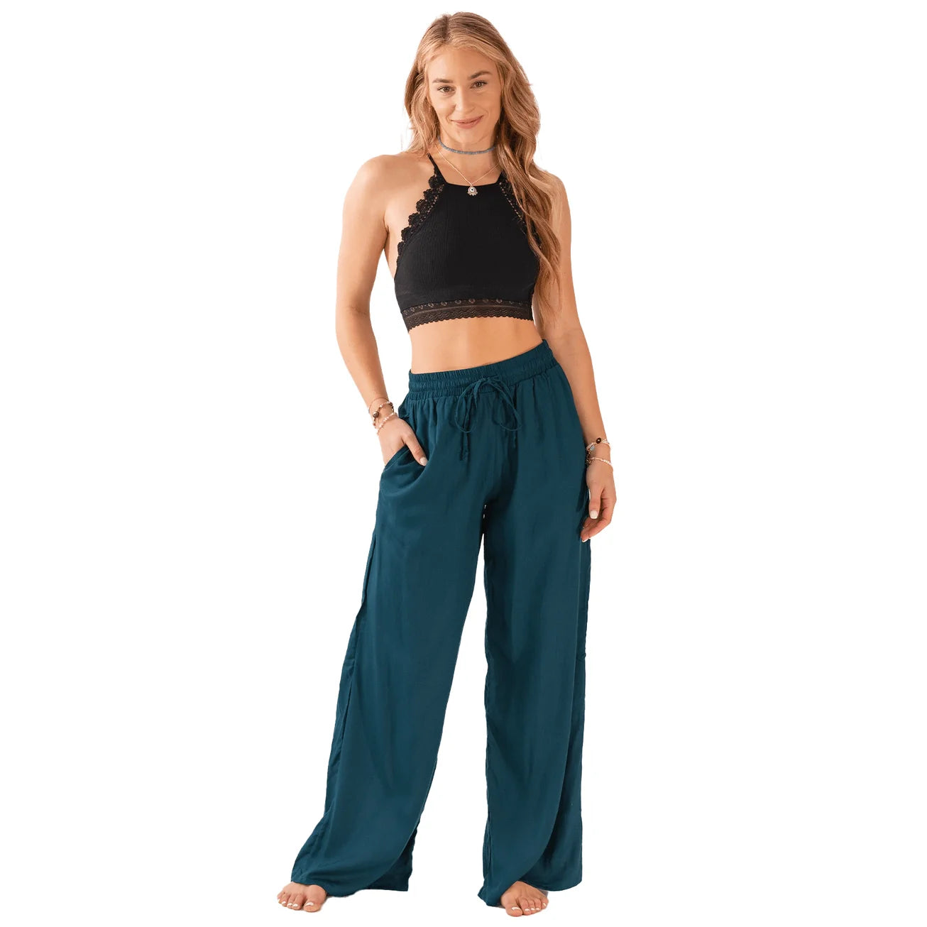 Deep teal wide leg drawstring pants with mid-rise elastic waist and front pockets.
