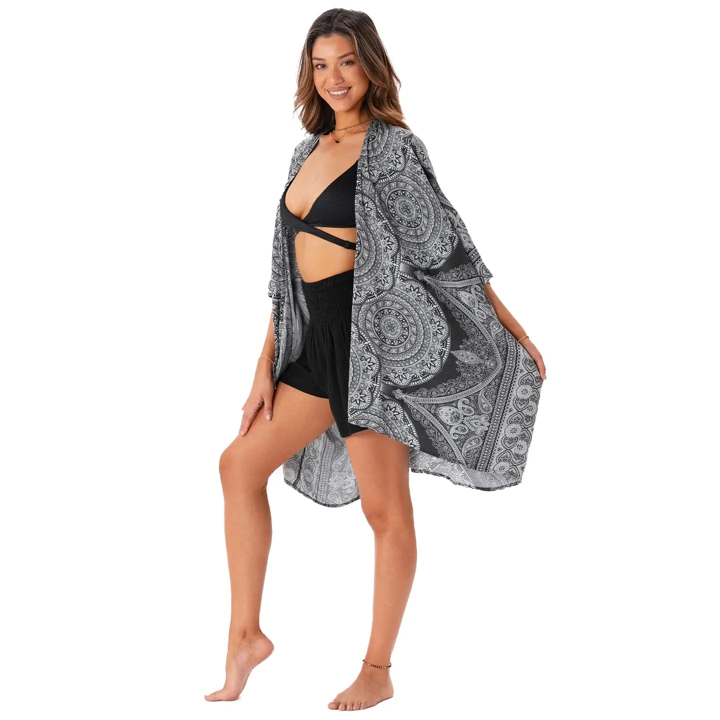 Balian Beach Kimono in black, worn over bikini for sun protection, mid-thigh length in back, mid-knee in front.